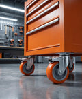 Close-up of 4pcs Inch M8 TPR Rolling Furniture Casters with Brake Orange on a tool cabinet, showcasing smooth swivel wheels.