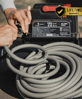 Kink Free Hybrid Air Compressor Hose Three Eighth By Fifty Foot Dual Quarter Inch Male Npt connected to compressor.