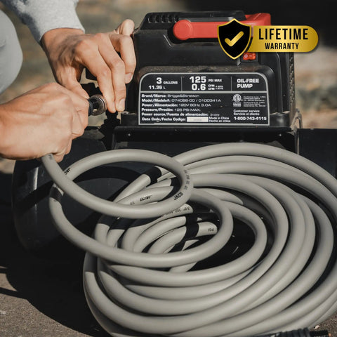 Kink Free Hybrid Air Compressor Hose Three Eighth By Fifty Foot Dual Quarter Inch Male Npt connected to compressor.