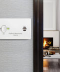 Carbon Monoxide Detector Battery Powered For Travel Or Home With 85 Decibel Alarm And LED Status Indicators Electrochemical Sensor No Wiring Required Two AA Batteries Included installed on wall.