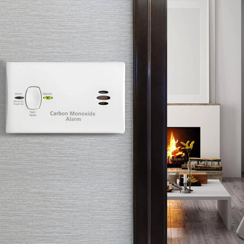 Carbon Monoxide Detector Battery Powered For Travel Or Home With 85 Decibel Alarm And LED Status Indicators Electrochemical Sensor No Wiring Required Two AA Batteries Included installed on wall.