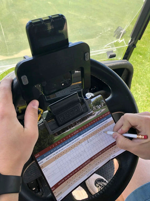 Golf Cart Steering Wheel Phone Mount Pro With Spring Loaded Arms And Scorecard Holder Fits Any Phone Two To Three Point Five Inches Easy On Off Made In USA Rotates Up And Down For Convenient Scorekeeping in use on golf course