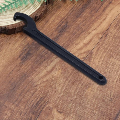 Heavy Duty C Hook Spanner Wrench In Matte Black crafted from tough as nails carbon steel for 22 to 26 mm round nuts on wood surface.