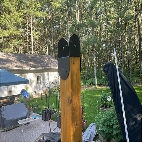 Heavy Duty 4x4 Inch Pergola Brackets Kit Metal Waterproof Connector Set 4 Piece installed on outdoor wood post in garden