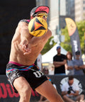Player hosting AVP OPTX Game Volleyball Official Size Yellow Black For Beach Play Durable Official Volleyball Construction With Enhanced Grip And Vivid Visual Design Great For Training Refs And Competitive Sand Sessions during match