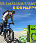 Cyclist on sandy trail with Two Pack 26x4 Fat Tire Bike Inner Tubes With 32mm Schrader Valve And Includes Two Tire Levers box.