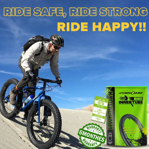 Cyclist on sandy trail with Two Pack 26x4 Fat Tire Bike Inner Tubes With 32mm Schrader Valve And Includes Two Tire Levers box.
