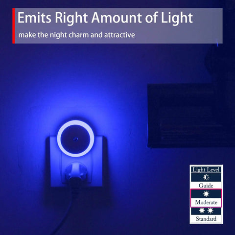 Blue LED Night Light Plug In Dusk To Dawn Sensor Small Round Nightlight glowing softly in a dark wall outlet