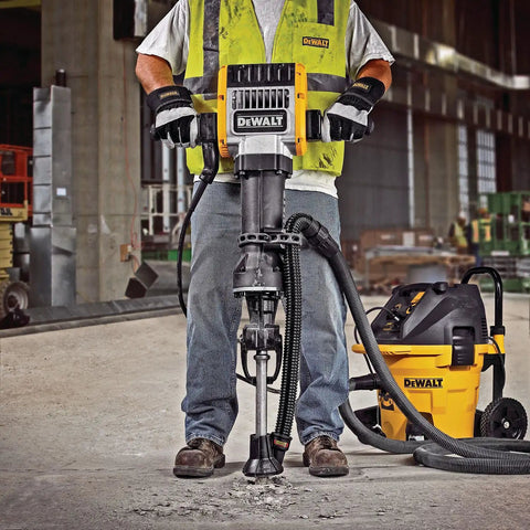 Worker using Heavy Duty Large Hammer Dust Extraction Attachment For Demolition Hammers With Universal Fit for pavement breaking.