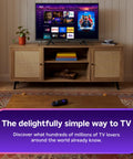 Next Level HD Media Stick Player With Clutch Voice Remote; TV setup showcasing streaming apps and remote on a coffee table.