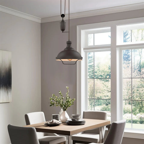 Dining area with Sequoia 13 Inch Dope Industrial Pulley Pendant Light With Dome Shade And Counterweight In Oil Rubbed Bronze Finish.