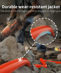 Heavy Duty Outdoor Extension Cord 25 Ft 12 AWG 3 Conductor, Waterproof showing durability over rocks.