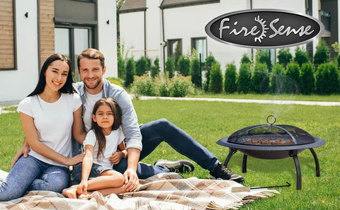 Family in garden with Portable Folding Fire Pit 29 Inch Round Steel Fire Bowl With Folding Legs Wood And Cookout Grate