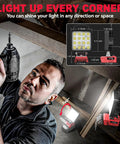 Man using Go To Cordless LED Work Light Flood Beam 3800 Lumen, 38W, 18V, in garage for DIY, showing angles and portability.