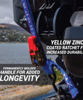 Close-up of Heavy Duty Ratchet Boat Straps Pack Of 2 With 2400 Lb Break Strength attached to a boat, showcasing yellow zinc ratchet and blue strap.