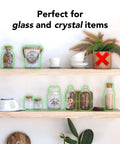 Decorative items secured on shelves with Clear Museum Gel Adhesive For Securing Collectibles And Decor Removable And Reusable Non Toxic Formula 4 Oz Container Keeps Your Stuff From Falling Off Shelves During Quakes Not For Wall Hanging Or Posters