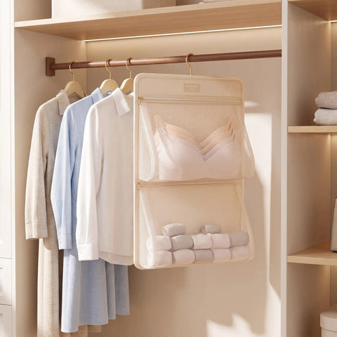Mesh Hanging Closet Organizer And Polyester Bra Underwear Storage Hanger Ultra Slim Vertical Lingerie Bag with bras and rolled towels.