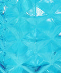 Close-up of blue glass texture from Tropical Pineapple Glass Patio Torch Set Of 2 For Outdoor Lawn Garden Deck And Backyard Lighting 63 Inch Tall Pineapple Vessel Blue Cool Backyard Party Vibe.