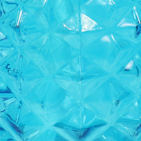 Close-up of blue glass texture from Tropical Pineapple Glass Patio Torch Set Of 2 For Outdoor Lawn Garden Deck And Backyard Lighting 63 Inch Tall Pineapple Vessel Blue Cool Backyard Party Vibe.