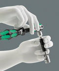 Hands using Zyklop 8794 LB Long Extension For Three Eighths Inch Square Drive With Free Turning Sleeve And Ball Lock, 200mm Reach