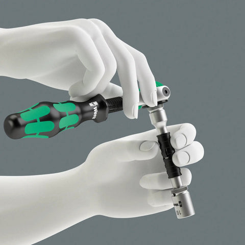 Hands using Zyklop 8794 LB Long Extension For Three Eighths Inch Square Drive With Free Turning Sleeve And Ball Lock, 200mm Reach
