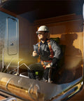Engineer holding 20 oz tumbler, seated in construction equipment cab, wearing hardhat and harness. Engineer Gifts Tumbler 20Oz For Mechanical Engineers And Civil Engineers Gift For Men Graduation Day Keepsake That Combines Practical Coffee Insulation With Geeky Style.