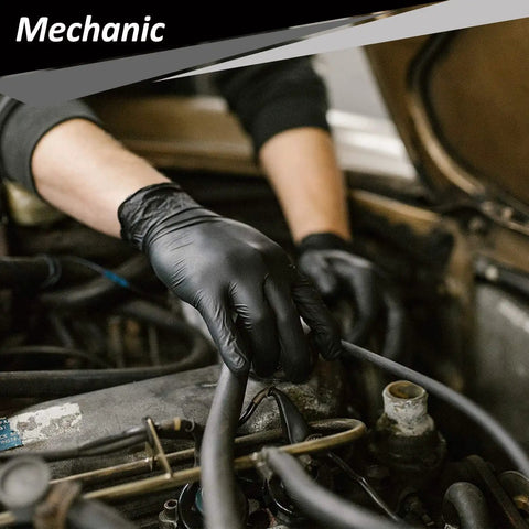 Mechanic wearing Nitrile Disposable Gloves 4 Mil, 200 Count, Powder Free and Latex Free, working on engine repair.
