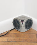 PestChaser Pro Heavy Duty Ultrasonic Rodent Repeller plugged in corner of hardwood floor in a white wall indoor setting