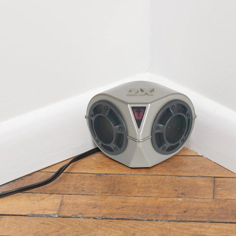 PestChaser Pro Heavy Duty Ultrasonic Rodent Repeller plugged in corner of hardwood floor in a white wall indoor setting