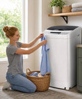 Woman placing a shirt into a Compact Portable Washer With Smart Auto Cycles And Delay Start Control for small spaces.
