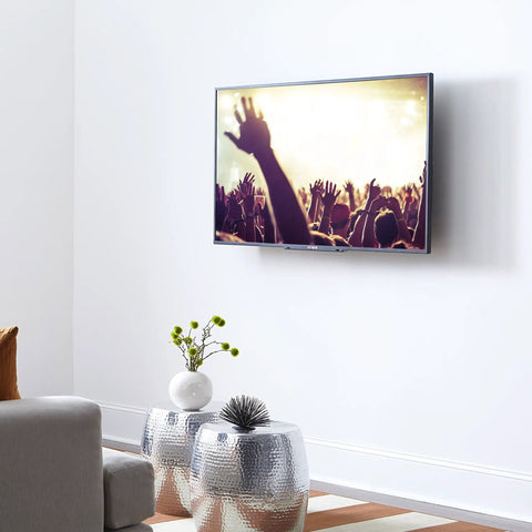 Ultra Slim TV Wall Mount For 32 To 80 Inch Flat Screens With Razor Thin 1.25 Inch Clearance and Smooth Pull String Locks in a living room setup.