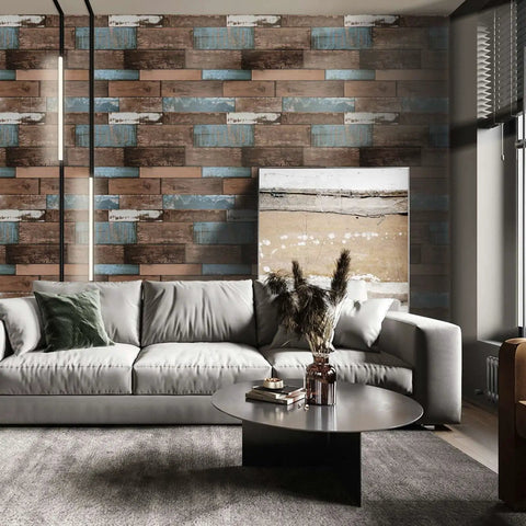Living room with faux wood peel and stick wallpaper for DIY projects, wood grain vinyl self adhesive contact paper, waterproof and removable shiplap texture for countertops cabinets and bathrooms, easy to install and budget friendly, measures 17.71 by 118 inches, on accent wall behind gray sofa and coffee table.