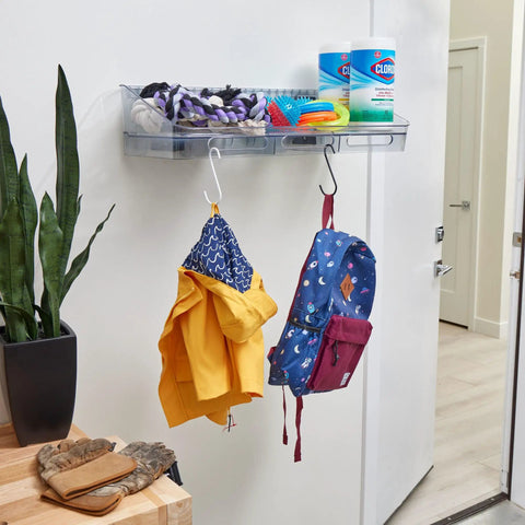 Clear Wall Mount Storage Bin And Shelf For Easy Organization Space Saving Wallspace Collection Organizer In Recycled Plastic Totally A Must Have Kitchen Bath Dorm Office And Home installed in a room holding cleaning supplies and hooks with items hanging.