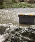 Toss Your Gear In This Heavy Duty 5.28 Gallon Waterproof Plastic Storage Tote Bin featuring a weather tight seal on wet ground.