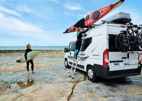 Van Telescoping Ladder With 9 Steps Extends To 8.5 Feet Easy Close System EN 131 Compliant Magnetic Fixation Kit Quick Vehicle Wall Mount Durable Aluminum Construction For Safe Roof Access And Hassle Free Day To Day Use mounted on white van