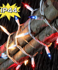 Patriotic String Lights Kit With Red White Blue Mini Lights On White Wire, 19.6 Feet, 100 Count wrapped around tree in rain