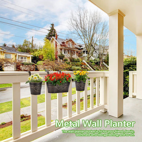 3 Pack Metal Railing Planter Boxes For Outdoors With 10.6 Inch Hanging Pots, Detachable Hooks And Drainage Holes, shown installed on a balcony railing.