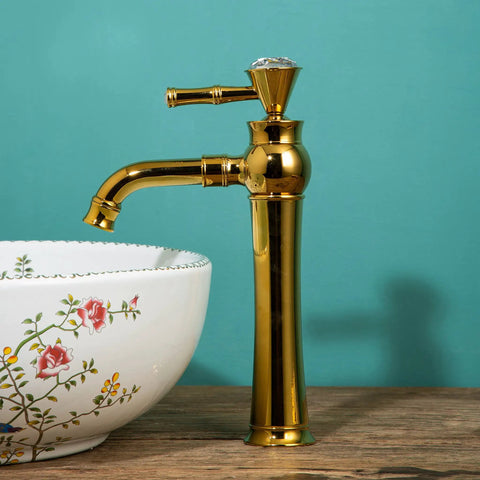 Gold Tall Vessel Sink Faucet With Single Lever Handle One Hole Deck Mount Vanity Mixer Tap For Bathroom, Premium Brass Construction next to floral basin.