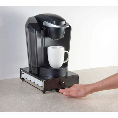 Rolling Mini Black Finish K Cup Drawer Organizer For Under Coffee Pot Storage holding a coffee machine on a countertop