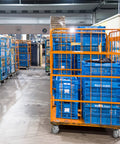 Image of warehouse with blue plastic bins on Heavy Hitter Grade Rubber Caster Wheels 5 Inch Industrial Casters Set Of 4.