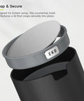 Compact Swing Top Mini Trash Can With Lid For Bathroom Vanity Countertop Desk Or Office 2.2L 7.3In Tall 5.3In Diameter Black Space Saver Tiny Trash Bin for Small Spaces showing lid snap feature.