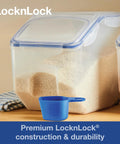 Heavy Duty Bulk Food Storage Containers With Smooth Rolling Wheels And Snap Tight Lids, 50 Cup Dry Goods Pantry Bin With Measuring Cup with rice inside.
