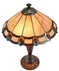 Aldridge Peacock Table Lamp in Antique Bronze Finish with hand rolled copper foiled art glass panels and cream amber backdrop.
