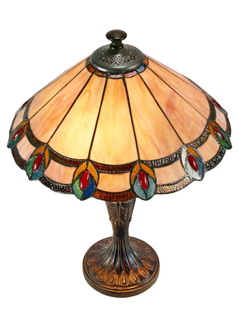Aldridge Peacock Table Lamp in Antique Bronze Finish with hand rolled copper foiled art glass panels and cream amber backdrop.
