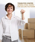 Woman holding 72-inch long heavy duty bungee cord with durable metal hooks for bikes, camping, outdoors; boxes in background