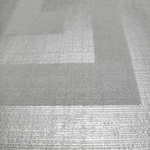 Close-up view of Modern Geometric Greek Key Wallpaper With Metallic Matte Finish, showcasing the gray silver texture.