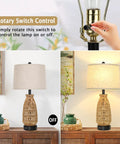 Set Of 2 Rattan Table Lamps With USB Ports, showcasing rotary switch and cream fabric shade on and off settings.