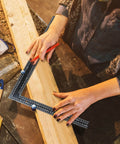 Person using Tall Stair Gauges For Framing Square Set, Non Slip Framing Jig For Easier And Faster Stair Layout, Blue Pack Of 2 on wood