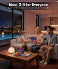 Family exchanging gifts with a Star Projector 4 in 1 Aurora Night Light With Bluetooth Speaker on the coffee table.