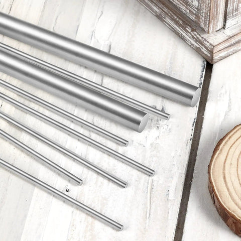 Four Pieces 10 Mm By 305 Mm 304 Stainless Steel Rods For DIYers And Model Makers on wooden surface
